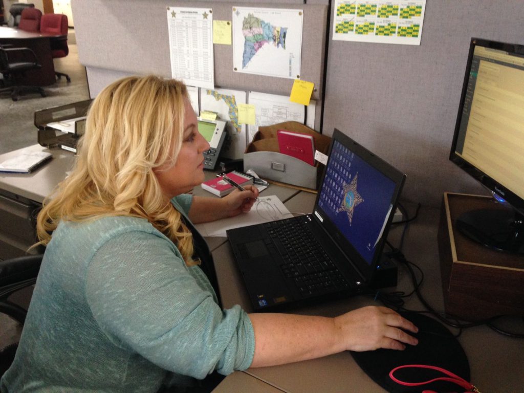 Angela Conboy using a laptop