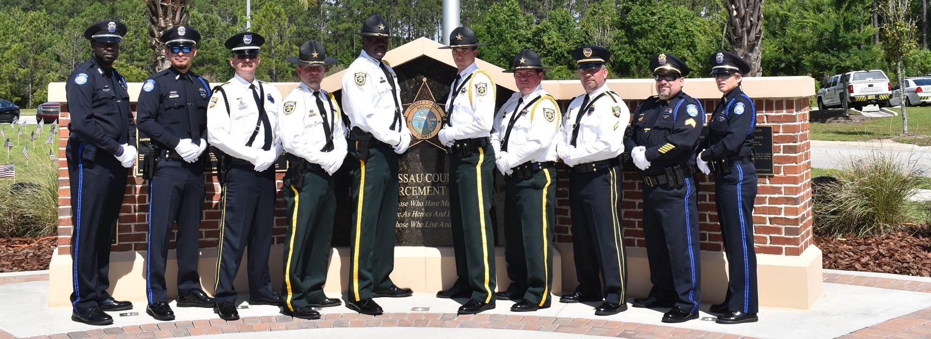 Ten male and female officers pose for a photo