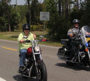 Citizen and Police Officer riding motorcycles