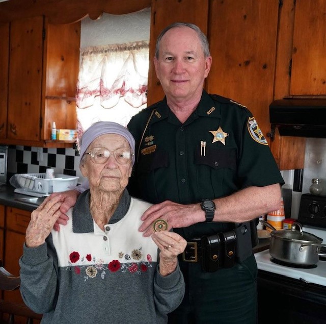 sheriff and elderly woman